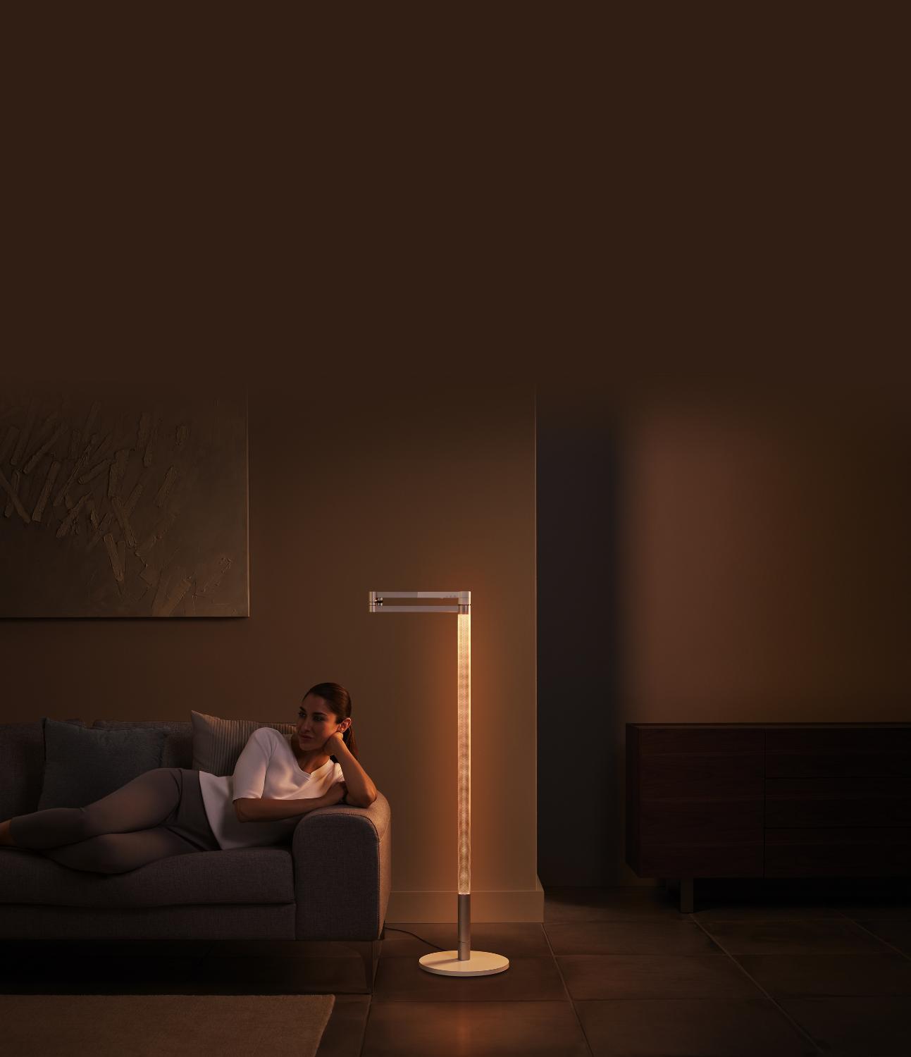 Women sitting on couch under the ambient light